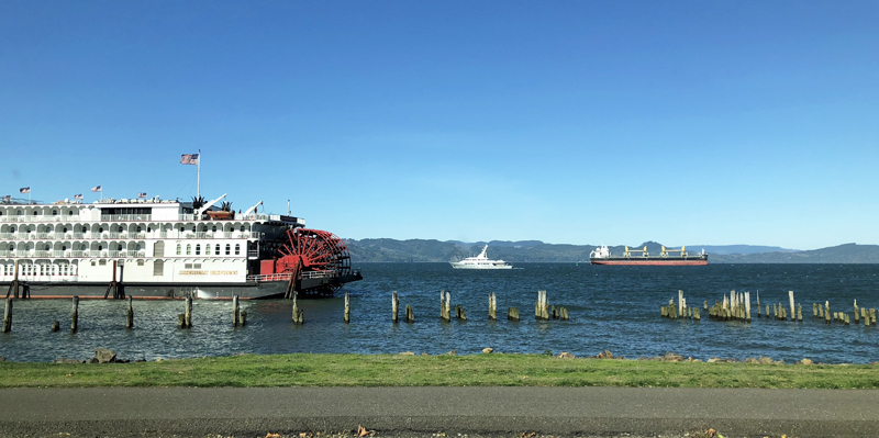 Astoria waterfront views of sternwheeler, ship and cargo barge