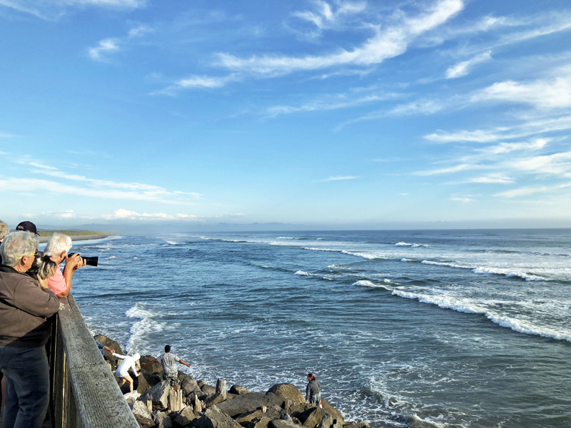 Astoria - Fort Stevens beautiful river and ocean view point, blue sky and waves