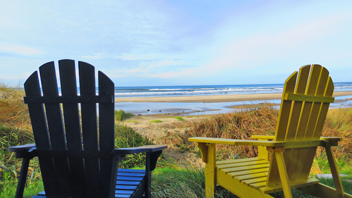 Oceanfront Adirondack chairs overlooking Heceta Beach from Whales Watch vacation home