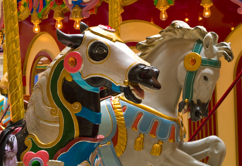 Two beautiful and colorful carousel horses at the Seaside Oregon Mall.