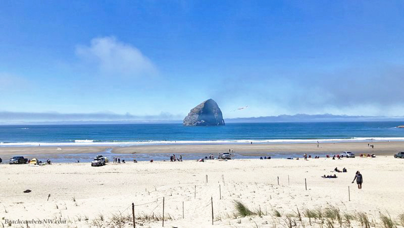 Haystack Rock and beach at Pacific City Oregon by Beachcombers NW
