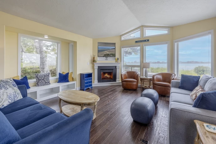 Waterfront living room with fireplace