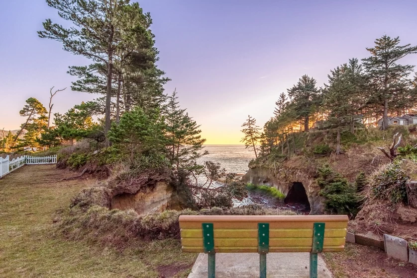 Oceanfront bench at sunset