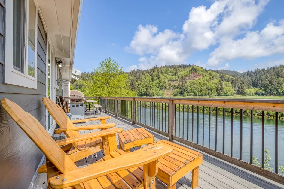 Riverside deck with Adirondack chairs
